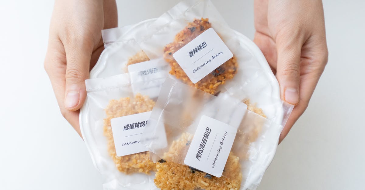 Keep Pakoras Crisp - Crop person holding plate with cookies in plastic bags