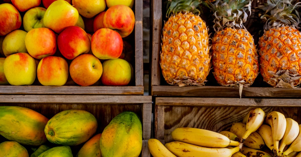 Keeping bananas fresh for longer - Four Trays of Varieties of Fruits