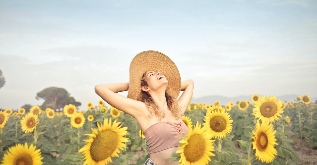 Keeping crawfish alive overnight? - Woman Standing on Sunflower Field