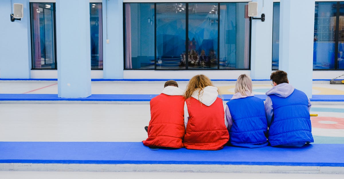 Keeping crushed ice from melting, without it joining back together - Unrecognizable people sitting on floor together