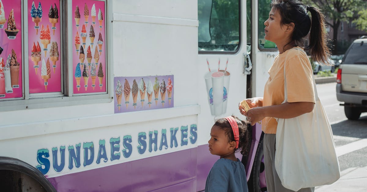 keeping ice cream fresh for 12 hours while transporting - Asian mother with little adorable daughter choosing ice cream