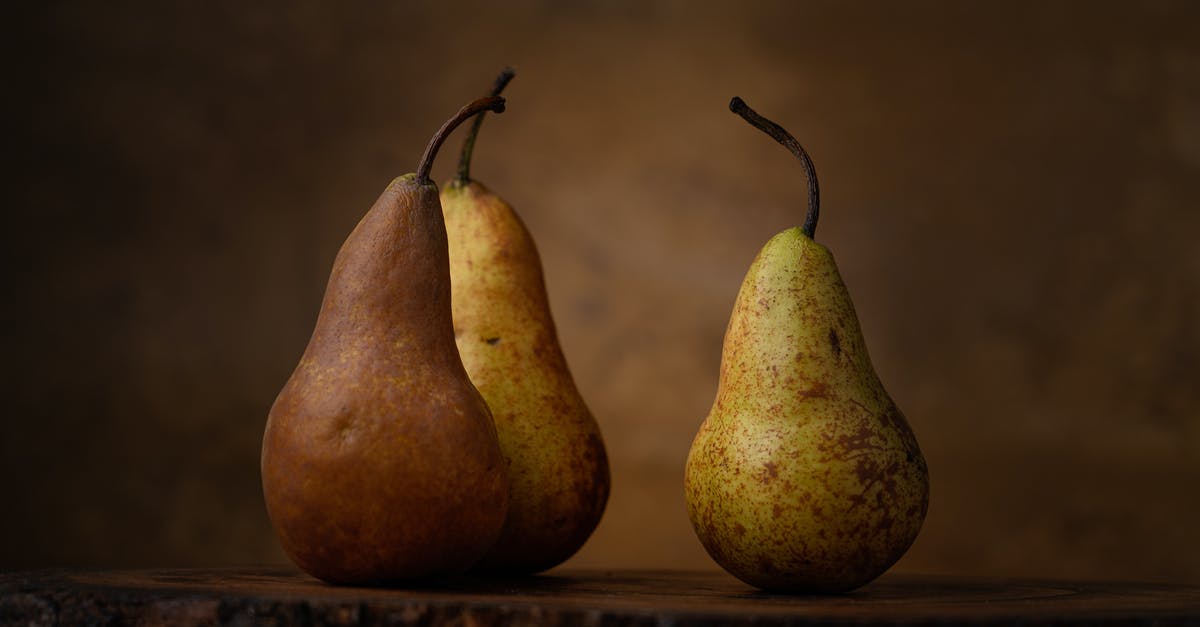 Keeping ripe pears for canning later - Pear Fruits on Brown Wooden Table