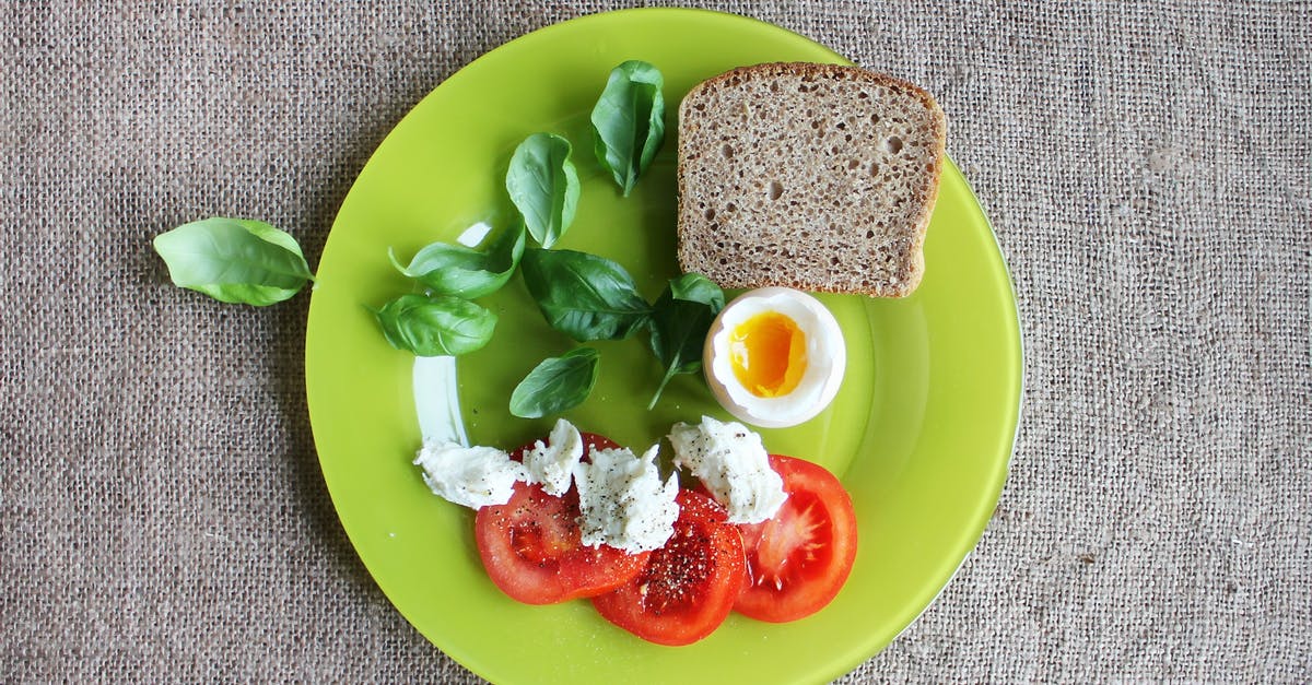 Keeping scrambled eggs with tomatoes from being too watery - Bread on Green Ceramic Plate