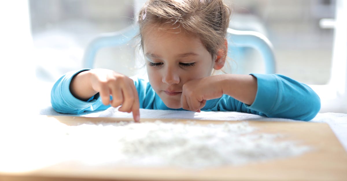 Keto replacement for flour - Girl in Blue Long Sleeve Shirt Playing on Brown Wooden Table