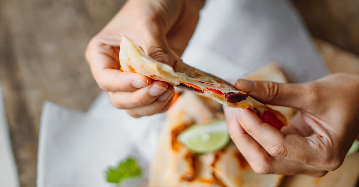 Key Lime Pie Filling - Thins out after pumping - Person Holding a Sliced Tortilla Wrap with Filling