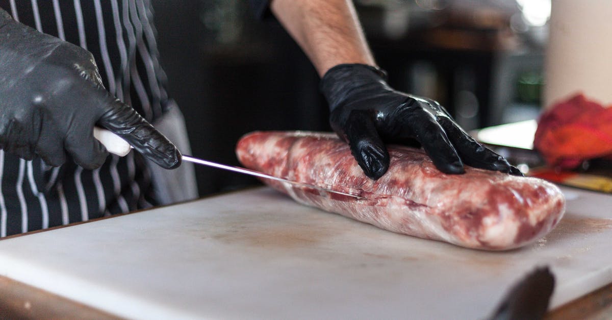 Knife for cutting steak slices from whole ribeye? - Person Slicing a Raw Meat