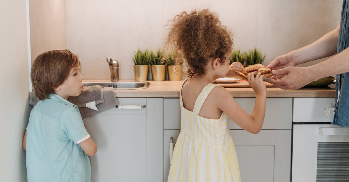 Lasagna in a sandwich maker - Woman in White Tank Top Holding Girl in White Dress