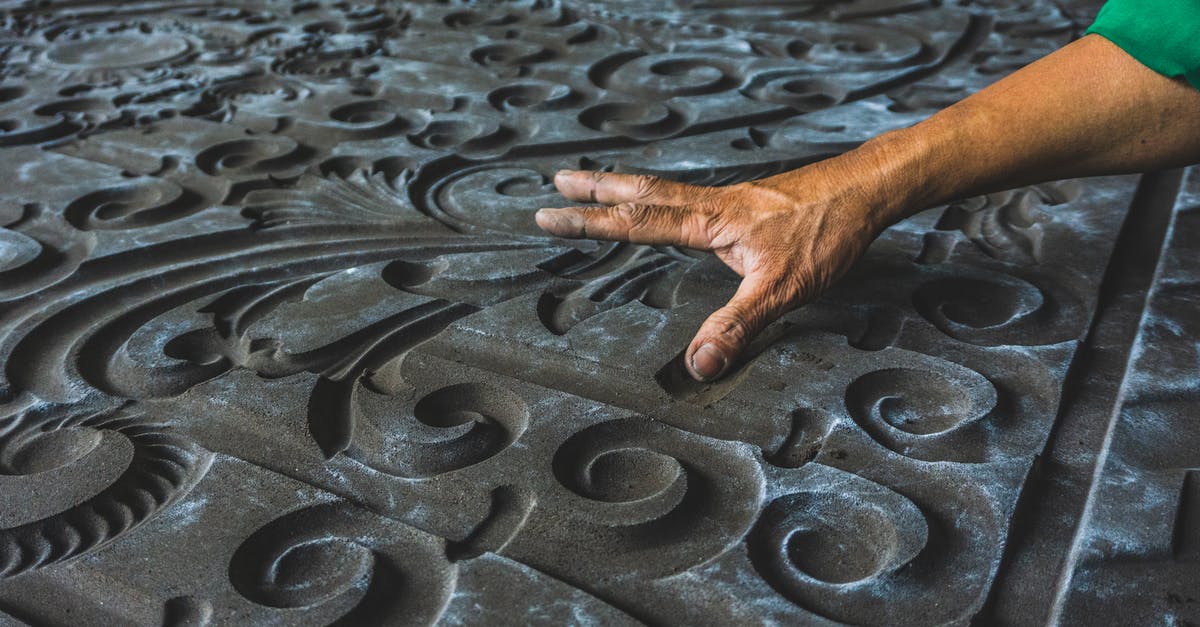 Latkes variations - Man Touching Stone Carving 