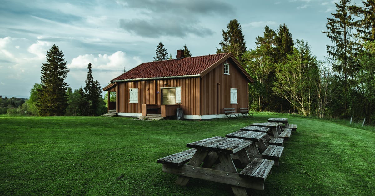 Le Creuset vs. Lodge Enamel - Brown Wooden House Near Trees