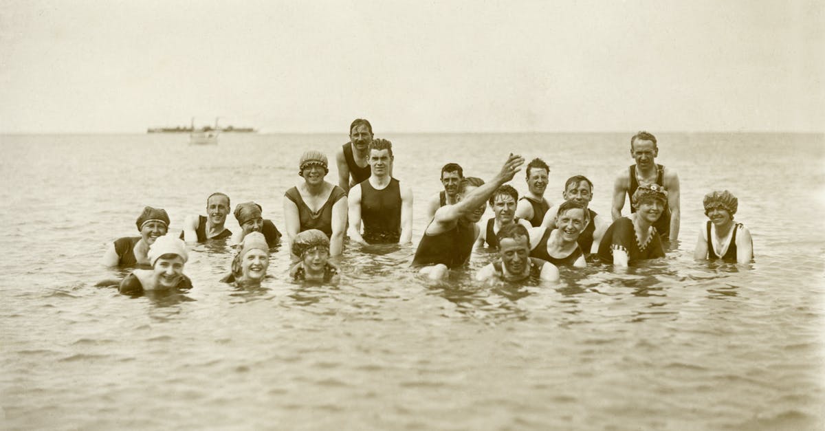 Leaving hard boiled eggs in water for several hours - Grayscale Photo of Group of People on Water