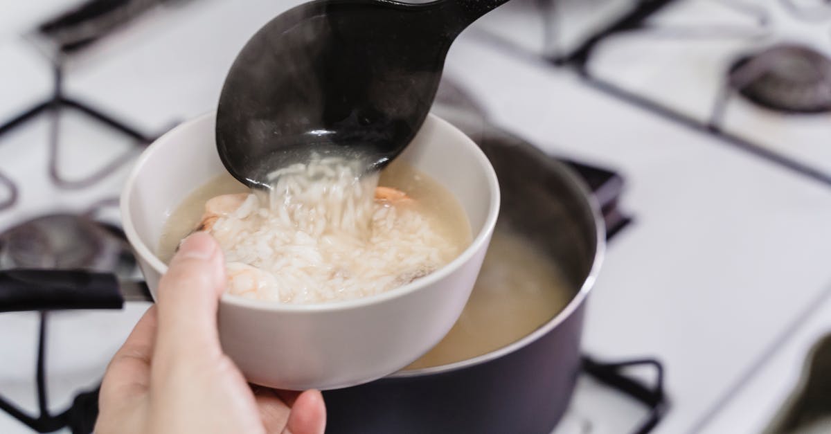 Leaving the ladle in the soup considered harmful? - Person Holding Holding a Rice Soup