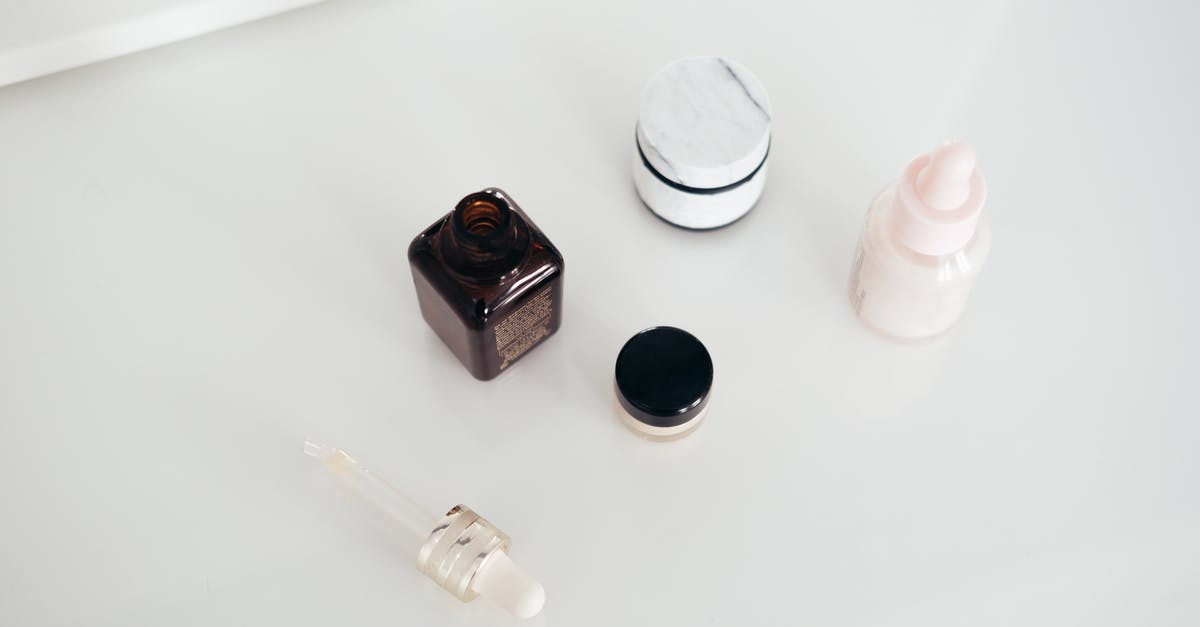 Leaving the lid open in a soup - Set of natural cosmetic products on table