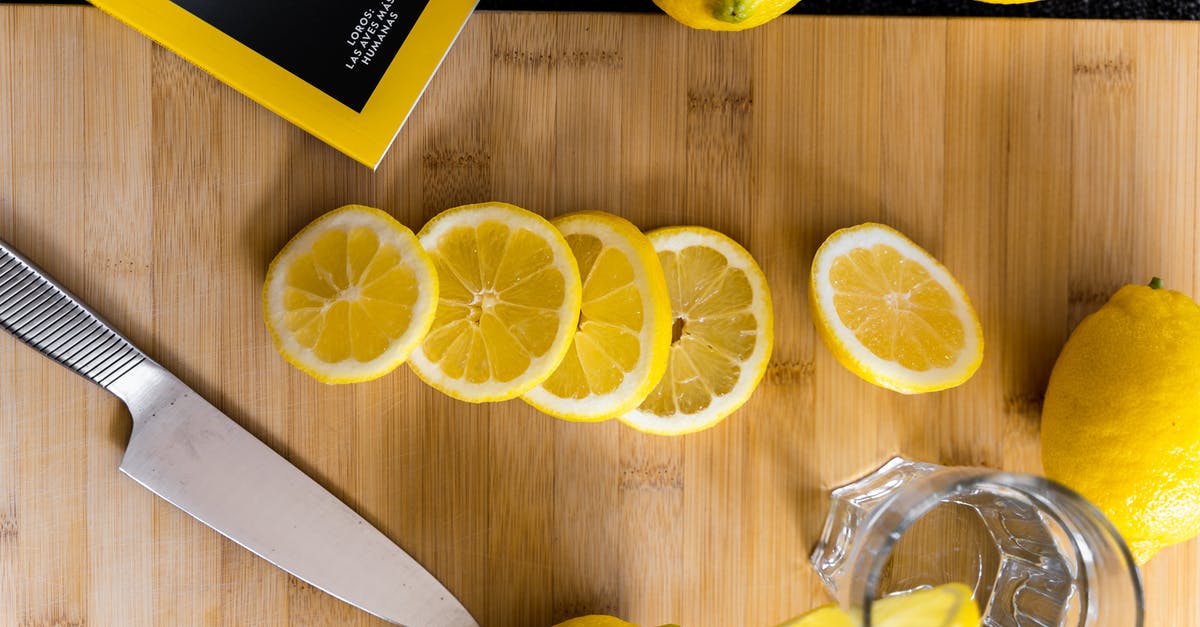 Lemon juice as drinking water preservative - Sliced lemons for fresh drink on table