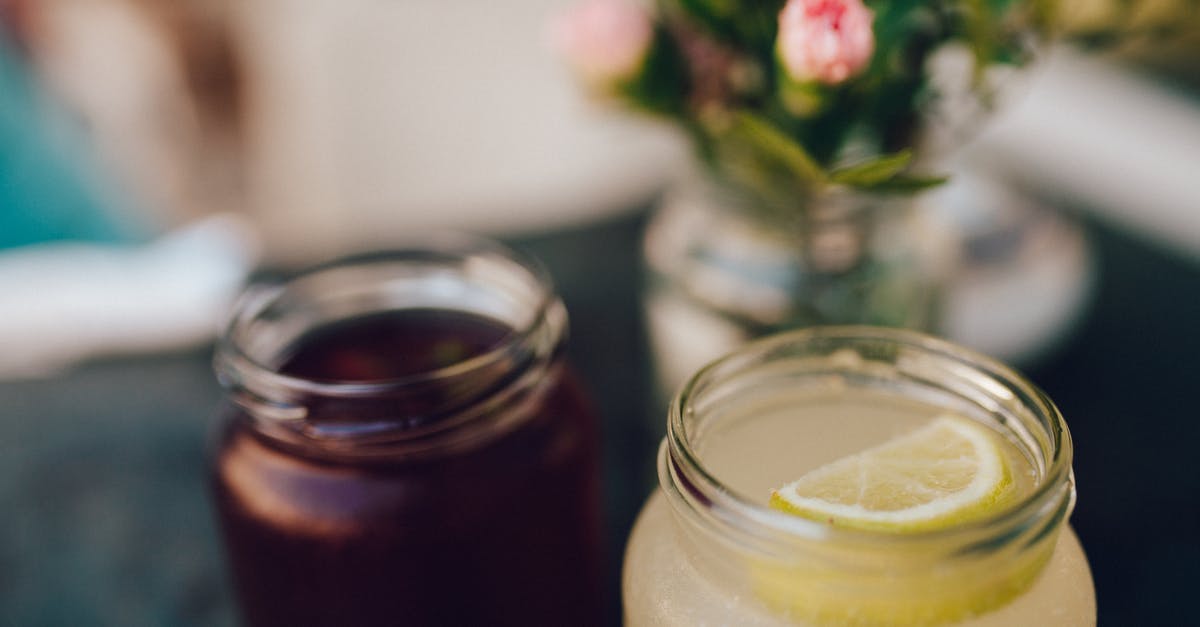 Lemon juice sprayer/container - Clear Glass Mason Jar With Lemon Slice on Top of Cocktail