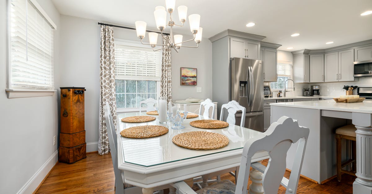 life without refrigerator - A Dining Table and Chairs with Brown Placemats