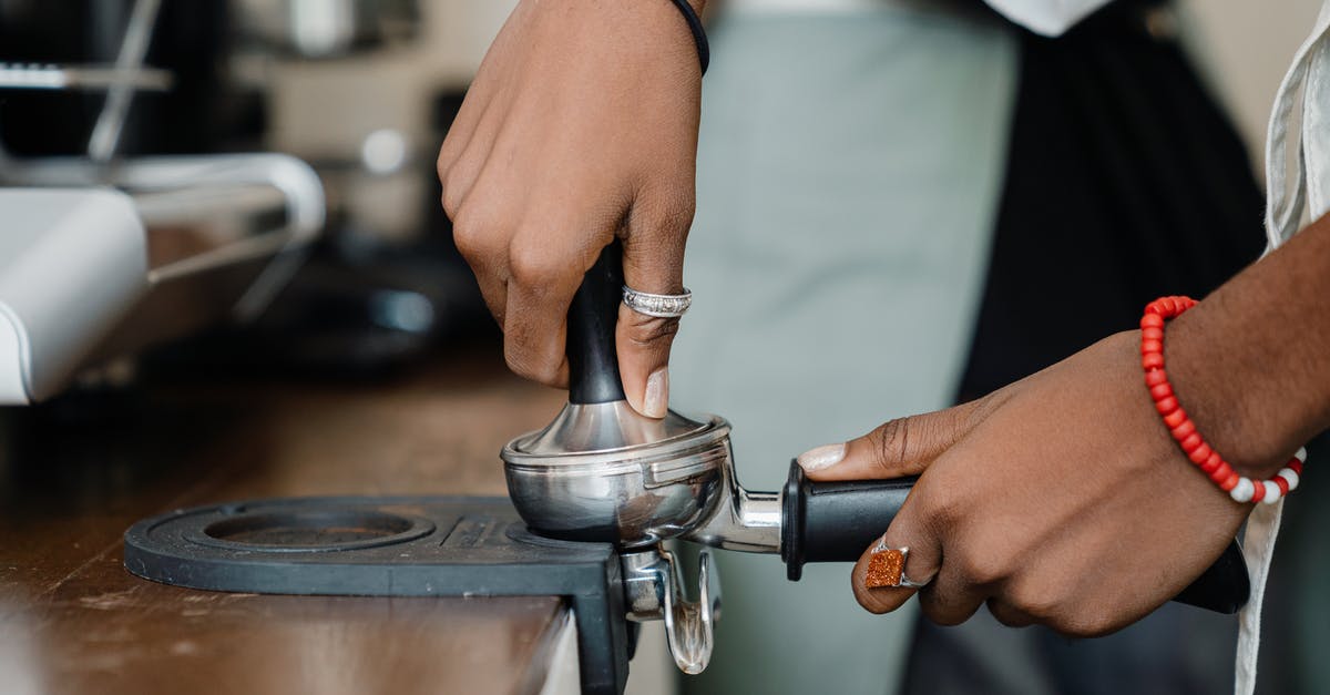 Lifetime of French press filter - Crop barista making fresh delicious coffee using professional machine