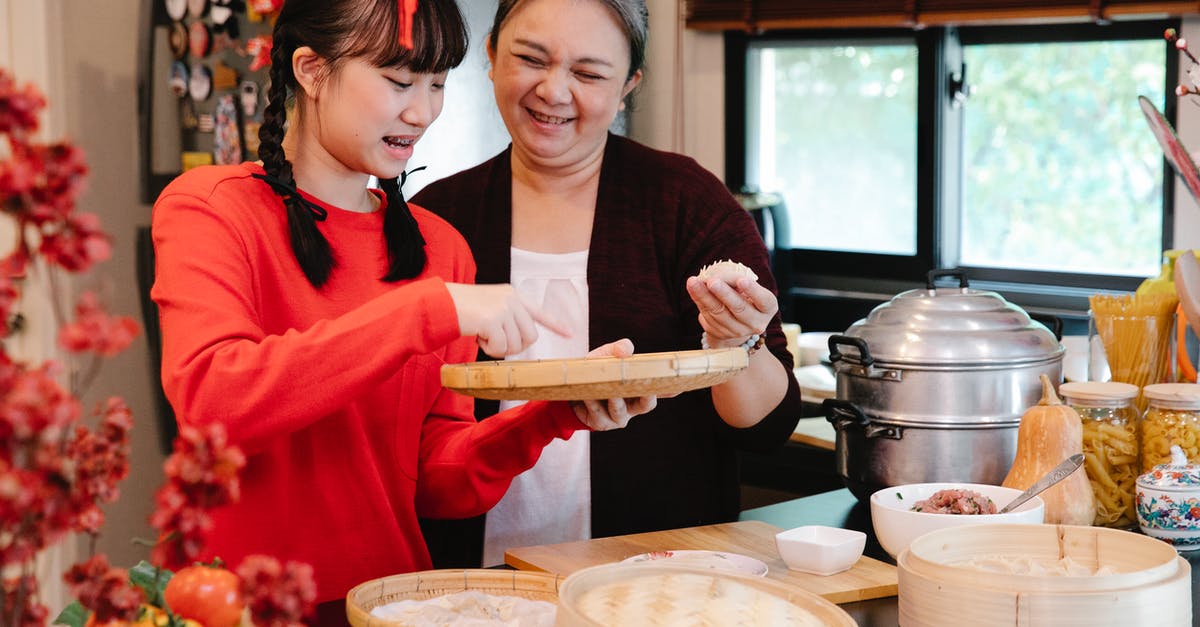 Looking for 10" bamboo steamer that will last! - Asian grandmother cooking dumplings with granddaughter