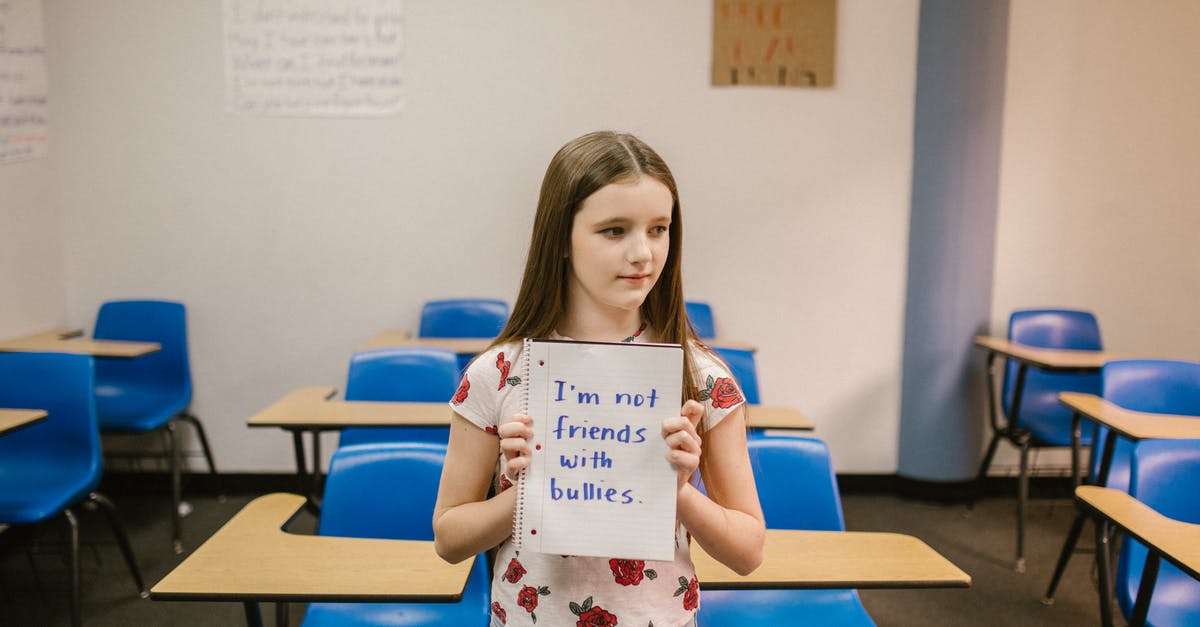 Looking for Rubbermaid "Servin' Saver™" container - Girl Showing a Message Against Bullying Written in a Notebook