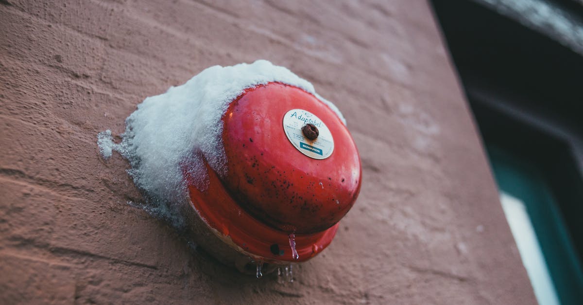 Low tannin dry red wine, good for sauces and stews? - From below of fire alarm button with snow and icicles on rough wall of house in winter town