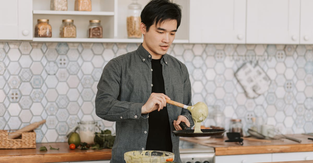 Lumps in pancake batter - A Man Putting Batter on a Cooking Pan