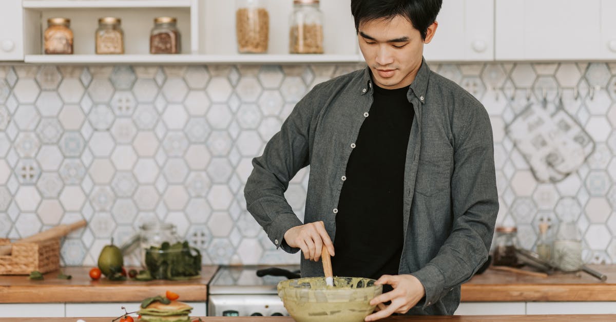 Lumps in pancake batter - A Man Stirring the Pancake Batter