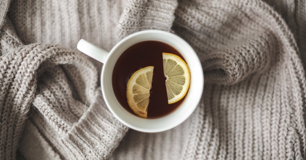 Make lemon balm tea - recommended method - White Ceramic Mug With Yellow and Black Flower