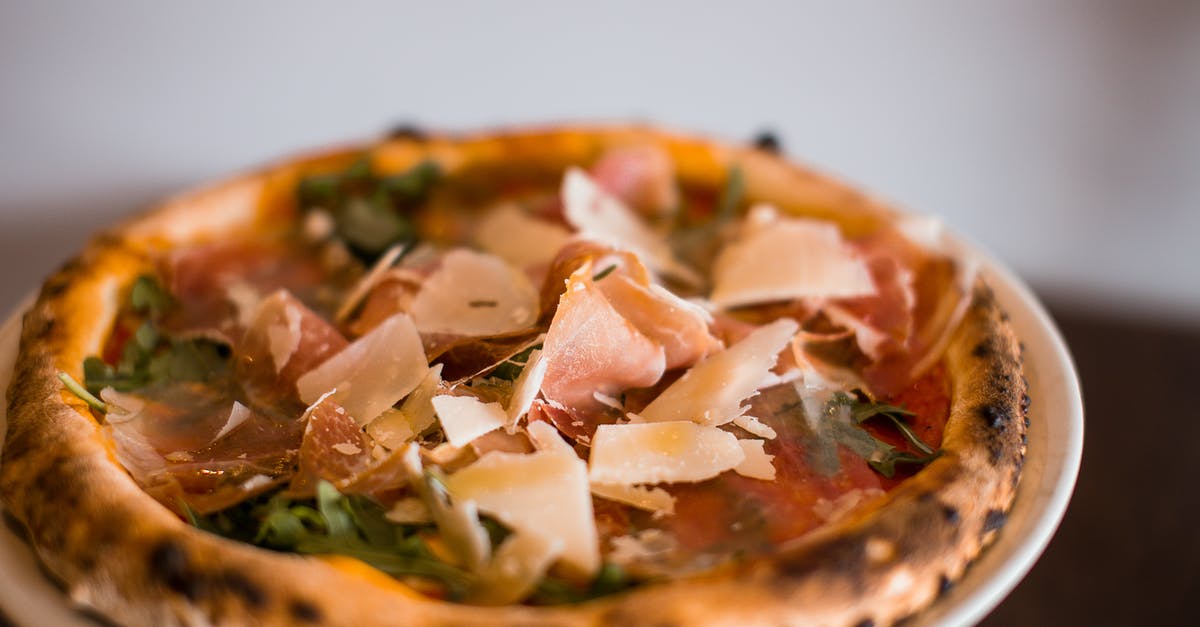 Making a goats cheese tart more substantial [closed] - Pizza With Cheese and Green Leaves