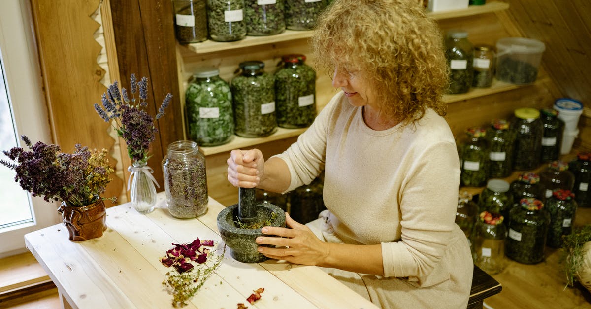Making a sorbet by cooking or by pureeing the ingredients? - Woman Making Herbs in Pounder