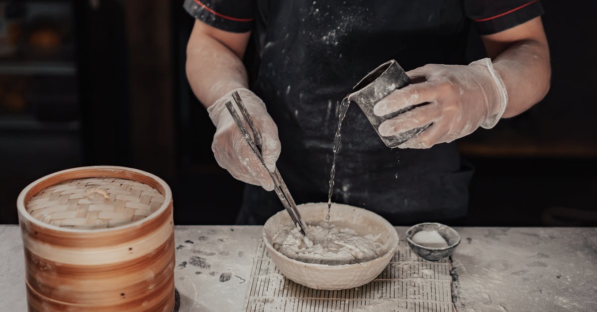 Making clarified butter by removing water but not the milk solids? - Person Holding Silver Steel Fork