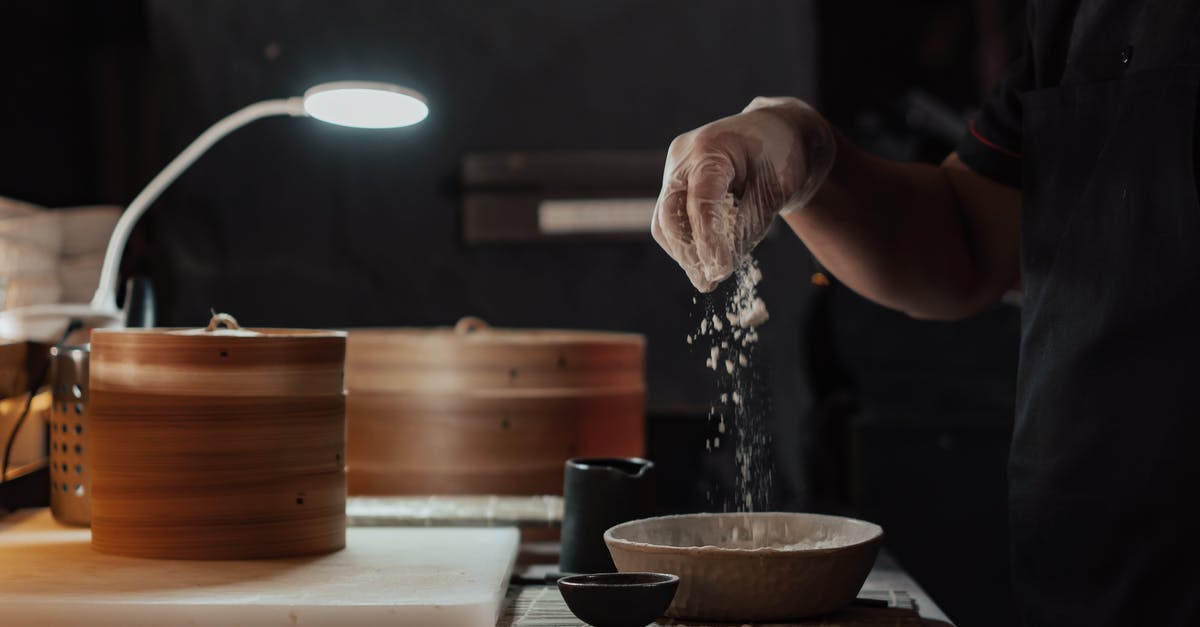 Making Dumpling Conserve Better - Person Sprinkling Flour on Bowl