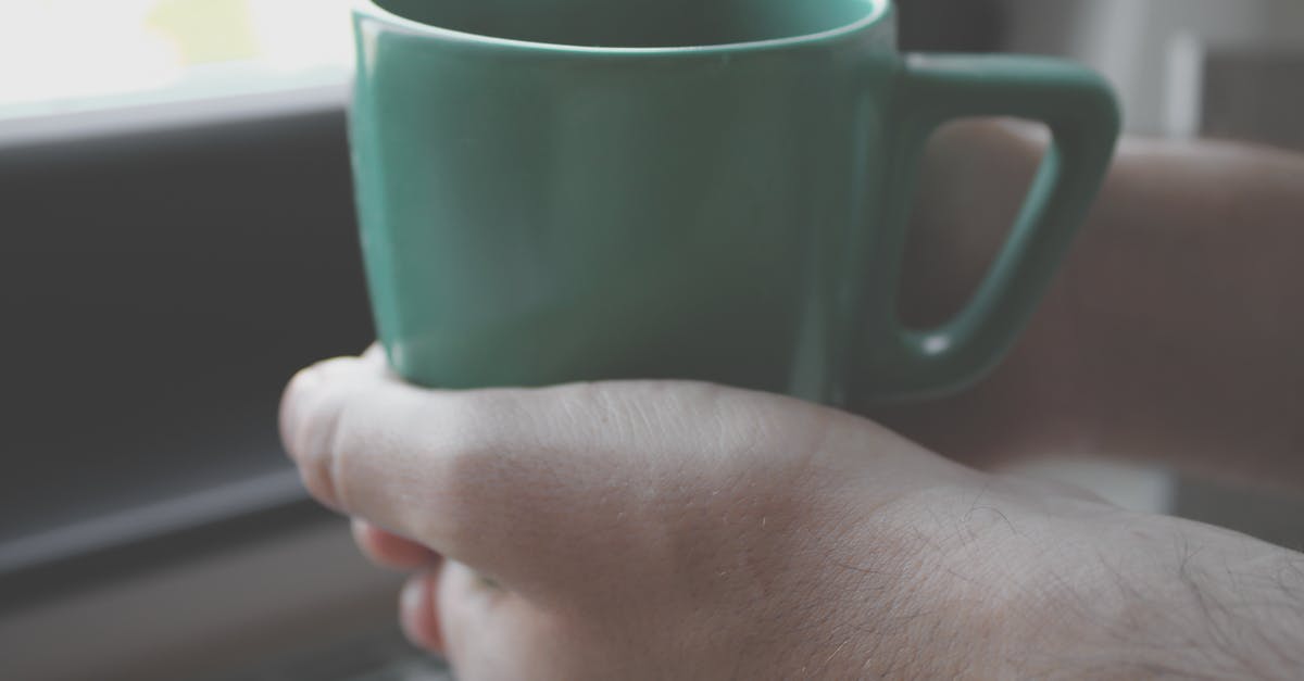 Making green tea [closed] - Person Holding Green Mug