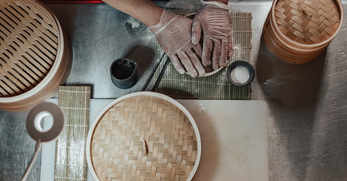 Making hazelnut flour with *just* blanched/peeled hazelnuts - Person in Gloves Cooking on the Table Beside Bamboo Baskets