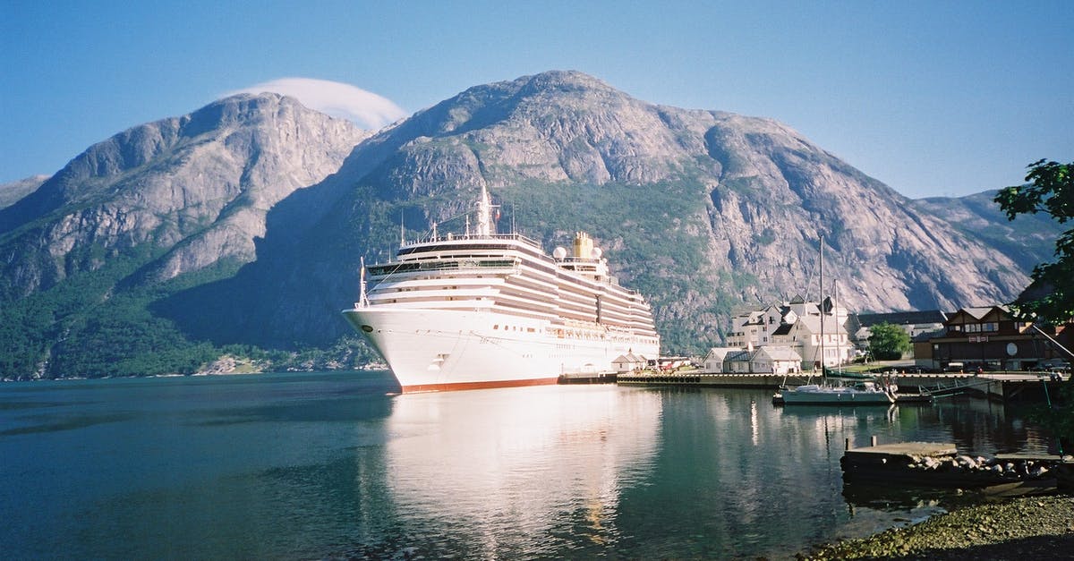 Making large amount of Gravy - White Cruise Ship on Water Near Mountain