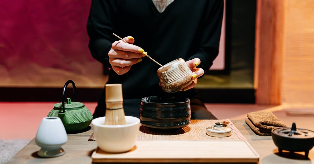 Making large quantities of tea with bags - A Person Making Tea