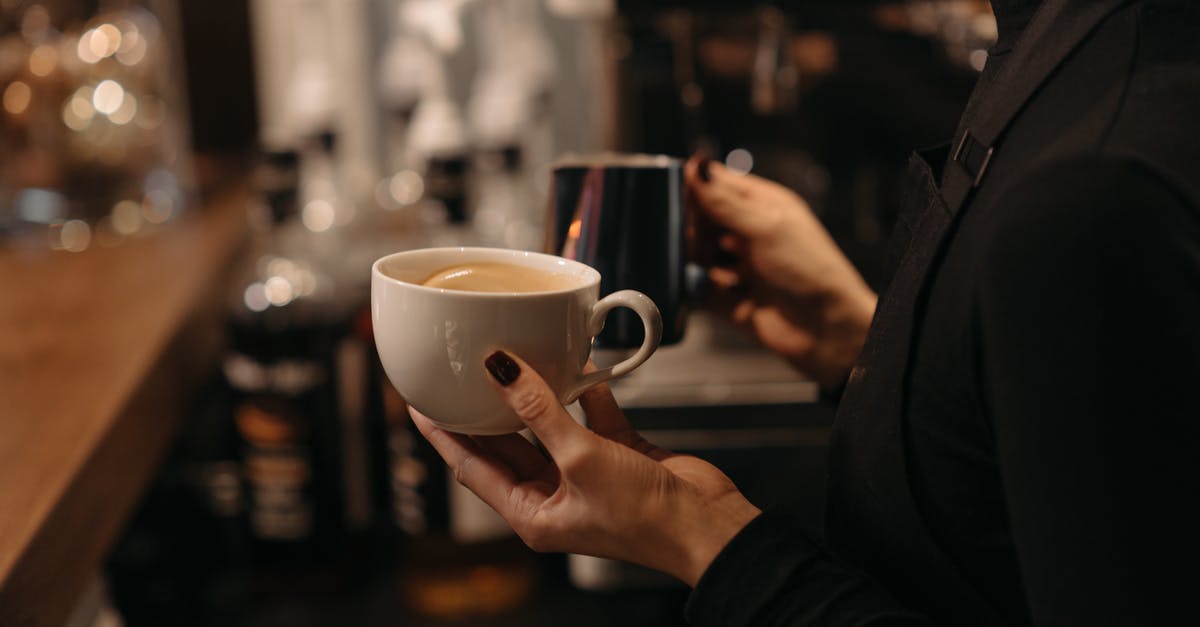 Making liquor with normal milk instead of UHT milk - A Person in Black Long Sleeves Making Coffee