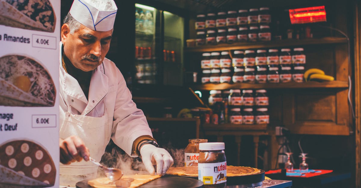 Making Nutella flow Smoothly - Person Cooking Inside Kitchen