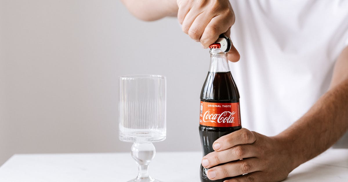 Making Pâté à bombe without sugar thermometer - Crop man opening glass bottle of cola