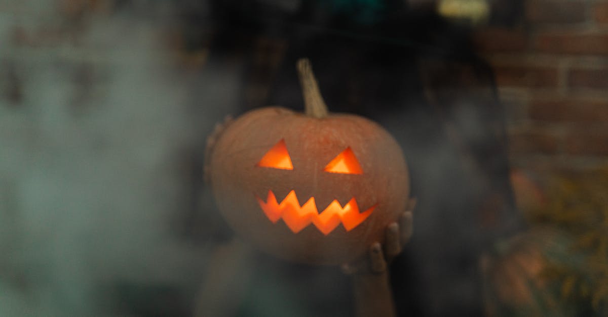 Making Pumpkin Preserve - Jack O Lantern on Black Table