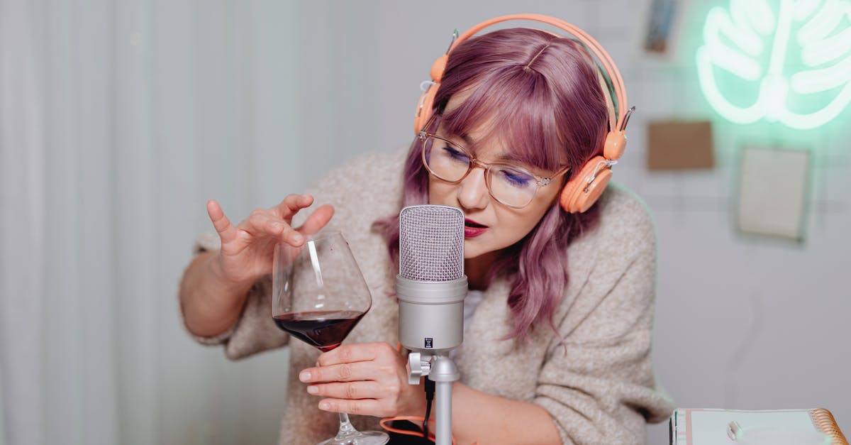 Making soda with yeast - Woman in Gray Sweater Holding Microphone