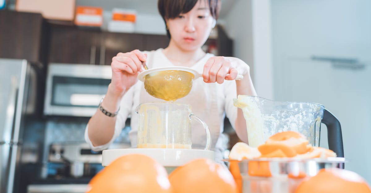 Making sorbet with fruit frozen before processing - A Woman Holding a Strainer