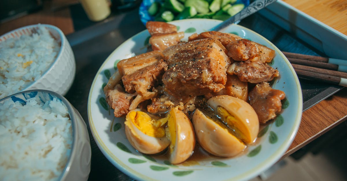 Marinade then cook or cook then marinade? - A Delicious Pork Adobo with Hard Boiled Eggs in a Bowl Beside Rice
