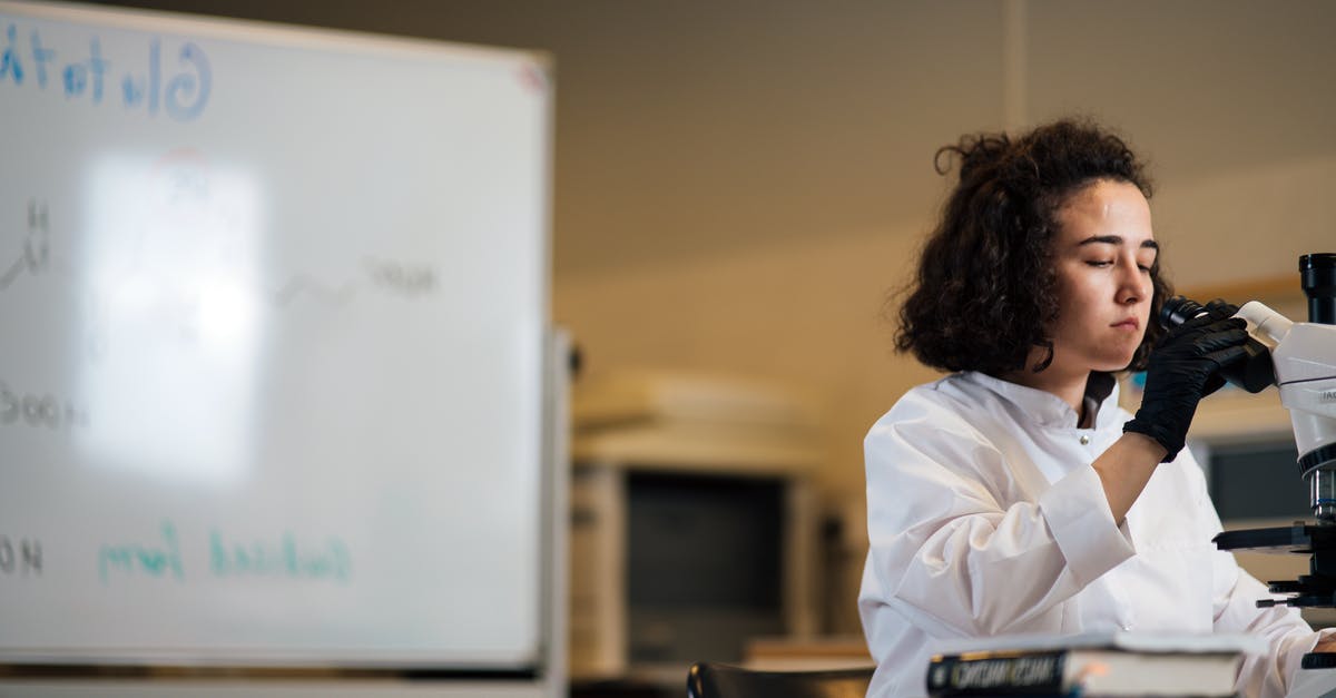 Matzoon and lactose chemistry - Woman in White Long Sleeve Shirt Sitting by the Table