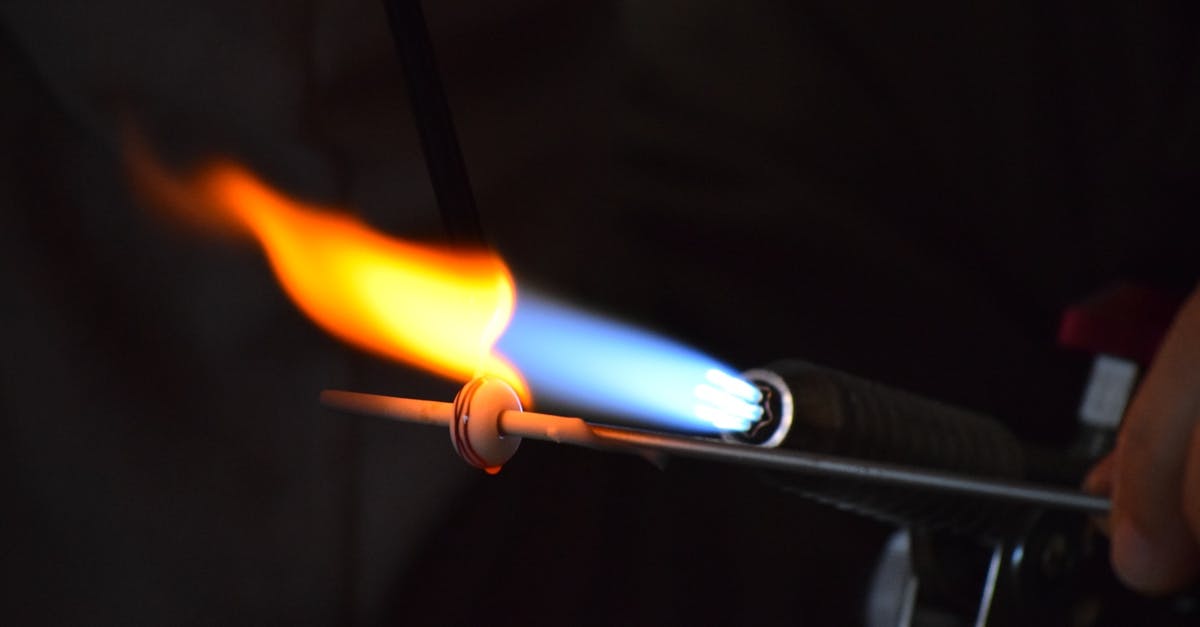 Melting sugar on creme brulee with blow torch - Light Torch Melting Metal