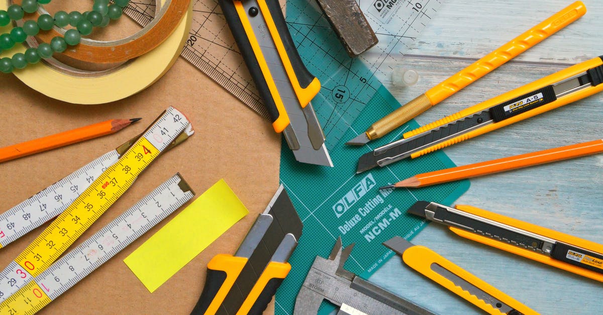 Method of sharpening knives with steel - Assorted-type-and-size Utility Cutters on Clear and Green Olfa Measuring Tool Near Adhesive Tape Rolls