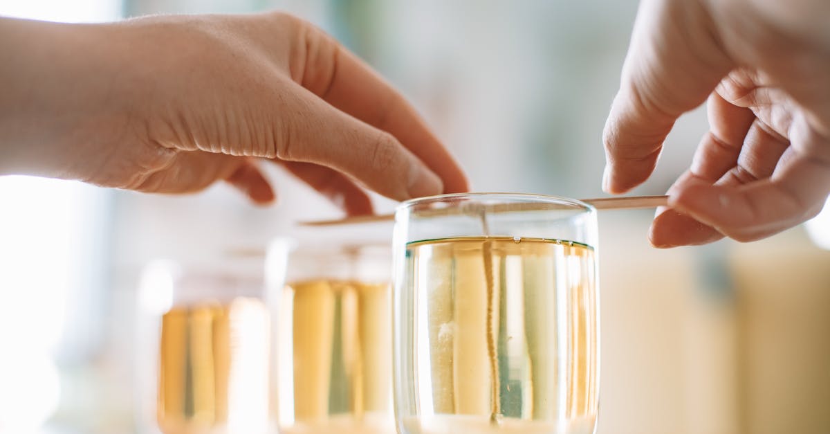 Milk for Coffee - Shake and Hit - Person Holding Clear Glass Jar With Yellow Liquid