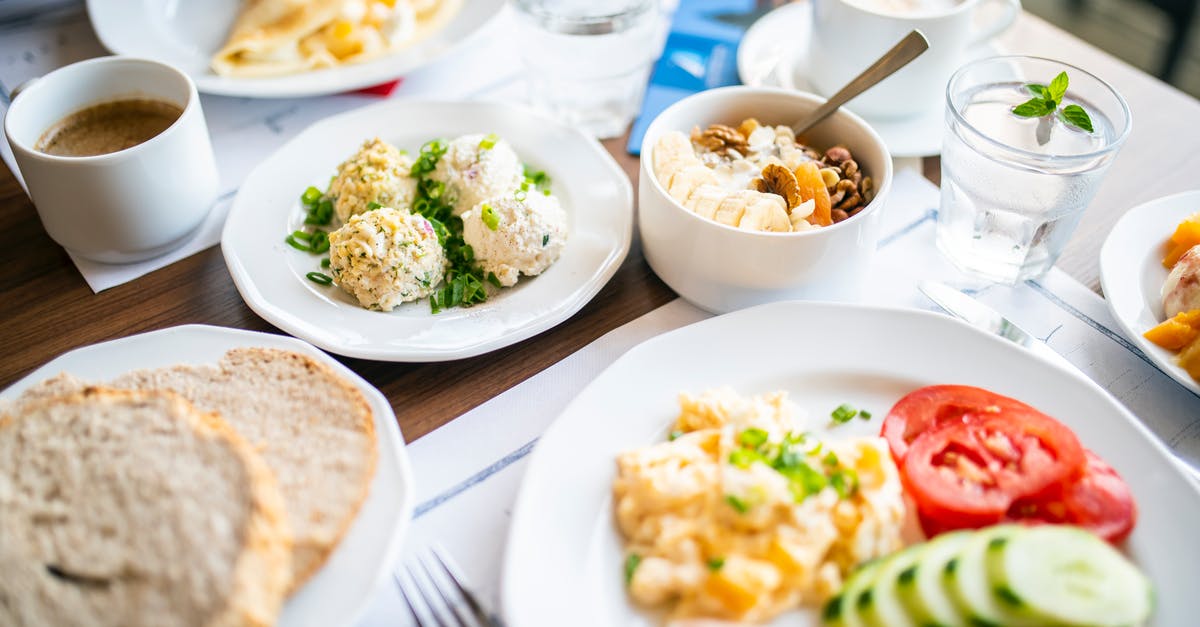 Milk or water for fluffier scrambled eggs? - Delicious breakfast of steamed cutlets and omelet in restaurant