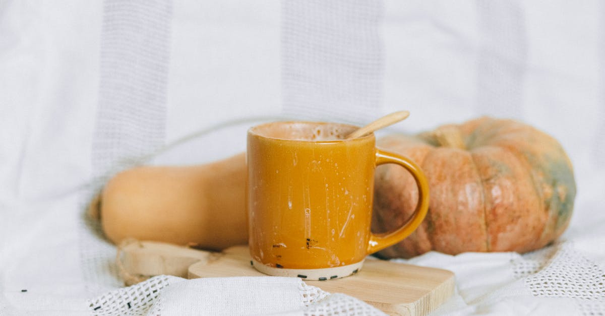 Milk temperature for white sauce - Yellow Ceramic Mug on White Textile