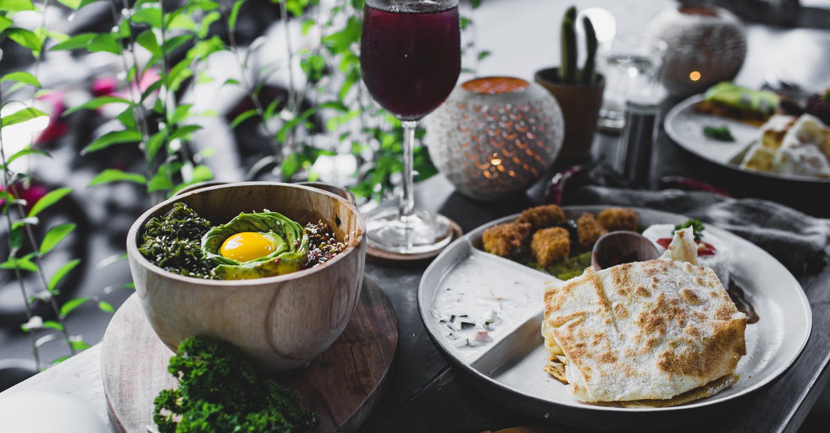 Mixed instant and cook and serve pudding - High angle of beautiful served table in outdoor cafe with various exotic dishes in bowl and plates