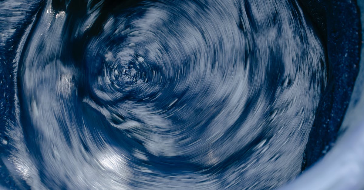 Mixing liquid margarine and water - Foamy indigo colored water in washing machine