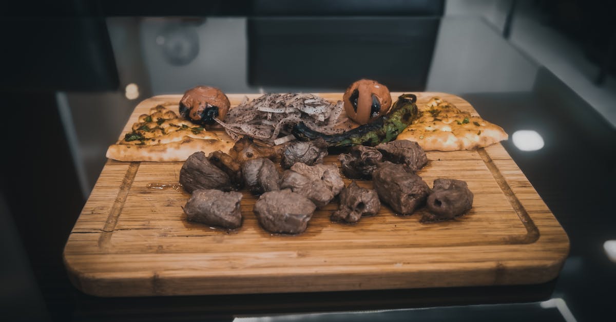 Mongolian BBQ Meat Cuts? - Delicious grilled food set on cutting board in kitchen